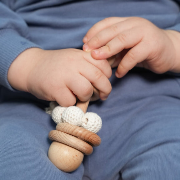 Little Explorer Set contents – wooden toy rattle and baby accessories, Cuddle Bloom